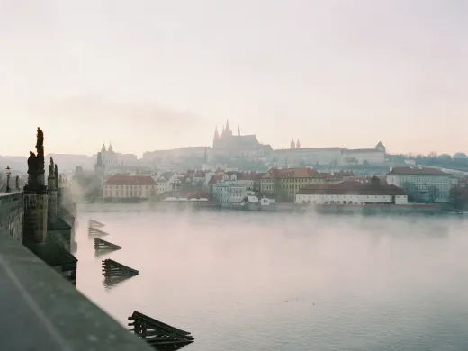 The Vltava at dawn, Prague Castle in the mist.